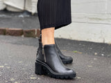 Carrano Cece ankle boots, European made of quality high shine leather Zipper, robust rubberized tractor sole. Grungy from Brazil. Goth platforms in black.
