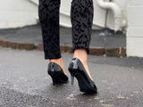 Comfortable, quality European women's stiletto sandal in patent leather. Wedding or special occasion shoe in black.