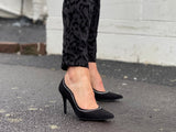 A pair of black suede high heels with a classic almond toe and sleek design, featuring diamante detailing around the upper. Comfortable, quality European women's sandal. Wedding or special occasion shoe in black.