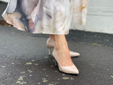 Comfortable, quality European women's stiletto sandal in patent leather. Wedding or special occasion shoe in nude.