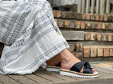Aerobics are quality European women's sandals and slides. Soft leather with crossover knot detail in black. Espadrille detail around the sole unit.