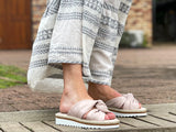Aerobics are quality European women's sandals and slides. Soft leather with crossover knot detail in nude. Espadrille detail around the sole unit.