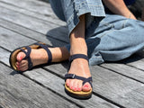 Quality European women's sandals. Made in Spain contoured cork footbed and rubber sole. Slide style sandal with toe ring that comes in blue.