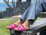 Quality European women's sandals. Made in Spain contoured cork footbed and rubber sole. Comfortable slide style sandal with triple buckles. Comes in fuchsia pink.