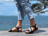 Quality European women's sandals. Made in Spain contoured cork footbed and rubber sole. Strappy sandal that comes in navy.