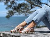 Quality European women's sandals. Made in Spain contoured cork footbed and rubber sole. Strappy sandal that comes in rose gold.