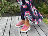 Comfortable women's slide  sandals. European from Spain. Soft quality leather straps and wedge sole unit. In fuschia.