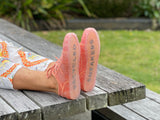 European sustainable women's fashion sneakers. Sole made from recycled plastic. Made in Spain in orange colour.