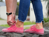 European sustainable women's fashion sneakers. Sole made from recycled plastic. Made in Spain in red colour.