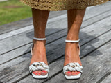 Comfortable, quality European women's sandals. Marian Becks sandals with a small kitten heel, featuring plaited chain-link detailing across the toe bar. Wedding or special occasion shoe in white.