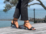 Comfortable, quality European women's sandals. Marian Becks sandals with a small kitten heel, featuring plaited chain-link detailing across the toe bar. Wedding or special occasion shoe in black.