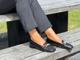 A pair of white loafers with gold embellishment detailing, comfortable, quality European women's shoes. Soft square toe available in black.