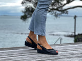 Dressy slingback sandal on a wedge sole unit. European shoe in soft leathers. Comfortable women's sandals.