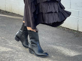 Black western style ankle boots with a burnished leather finish, zipper entry. Robust sole, pull tabs and scalloped collar, European handmade in Portugal with quality leathers, beautiful women's boots.