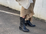 Black western style ankle boots with a burnished leather finish, zipper entry. Robust sole, pull tabs and scalloped collar, European handmade in Portugal with quality leathers, beautiful women's boots.