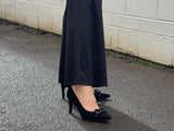 Comfortable, quality European women's stiletto sandal in suede leather. Quirky chain link detailing across the toe bar. Wedding or special occasion shoe in black.