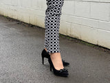Comfortable, quality European women's stiletto sandal in suede leather. Quirky chain link detailing across the toe bar. Wedding or special occasion shoe in black.