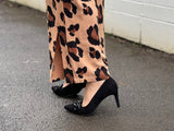 Comfortable, quality European women's stiletto sandal in suede leather. Quirky chain link detailing across the toe bar. Wedding or special occasion shoe in black.
