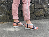 Comfortable women's sandals. European from Spain. Easy to get on with elasticated straps and cushioned wedge sole unit. In black/silver.