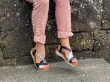 Comfortable women's sandals. European from Spain. Easy to get on with elasticated straps and cushioned wedge sole unit. In black/silver.