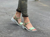 Woman's green chunky sole sandal with a buckle fastening. Buckle up ankle strap, lightweight and cushioned footbed.