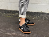 Comfortable sneakers, soft leather rubber sole unit. Great women's shoes for everyday wear in black white stripes.