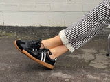 Comfortable sneakers, soft leather rubber sole unit. Great women's shoes for everyday wear in black white stripes.