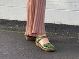 Smart green sandal in soft leather uppers. Velcro strap, wedge sole unit with enclosed heel and enclosed toe. Comfortable women's sandal with floral detail. Women's shoes with cushioned footbed.