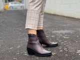Burgundy western style ankle boots with a high shine, textured leather finish, zipper entry. Robust rubberized sole. European handmade in Portugal with quality leathers beautiful women's boots.