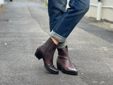 Burgundy western style ankle boots with a high shine, textured leather finish, zipper entry. Robust rubberized sole. European handmade in Portugal with quality leathers beautiful women's boots.