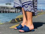 Quality European women's slide sandal. Soft leather with frill trim. In blue