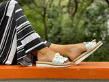 Aerobics are quality European women's sandals and slides. Soft leather with bow detail in white.