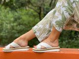 Aerobics are quality European women's sandals and slides. Soft leather with crossover detail in white. Espadrille detail around the sole unit.