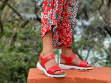 Comfortable European women's sandals.  Made in Portugal with anatomic cork footbed offering full support, fully adjustable with Velcro straps/fastening. In orange.