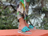 Aerobics are quality European women's sandals and slides. Soft leather with bow detail in jade.