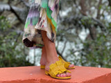 Quality European women's slide sandal. Soft leather with frill trim. In yellow