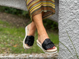 Aerobics are quality European women's sandals and slides. Soft leather with bow detail in black.