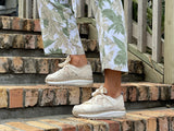 Quality European women's shoes. Made is Spain comfortable sport luxe fashion sneakers. Espadrille detail in beige.
