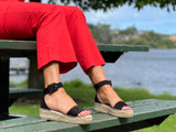 Flat Spanish espadrille sandal. Quality women's sandals and shoes made from suede leather in black. Buckle ankle strap, jute sole unit.