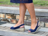 Navy blue espadrille wedge sandals with a button detail at the toe and a jute sole unit. Spanish women's footwear and shoes.