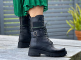 Women's boots, refined, combat style, quality leather boot, lace up with elasticated gusset and buckle detail. European, hand made in Portugal. Stylish and comfortable ankle boot. Midcalf black boot with a chunky rubber sole.