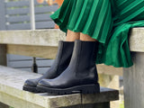 European ankle boots hand made in Portugal from quality leather. Black pull-on combat boots with a high shine leather. Elasticated gussets. Comfortable women's boots with chunky robust sole unit.
