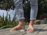 Aerobics are quality European women's sandals and slides. Soft leather with crossover detail in camel. Espadrille detail around the sole unit.