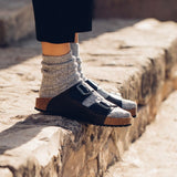 Quality European women's sandals. Made in Spain contoured cork footbed and rubber sole. Comfortable slide style sandal with double buckle detail. Birkenstock style sandal in black.