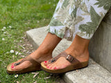 Quality European women's sandals. Made in Spain contoured cork footbed and rubber sole. Comfortable thong style sandal with buckle. Birkenstock style sandal in brown.