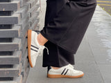 Comfortable sneakers, soft leather rubber sole unit. Great women's shoes for everyday wear in white black stripes.