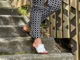 Classic European slide with fringe detail. Made in Spain from quality leathers, comfortable women's sandals/slides. In off white.