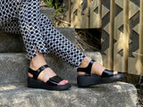 Quality European women's sandals. Made in Spain from soft patent leather. Comfortable wedge sandals in black.
